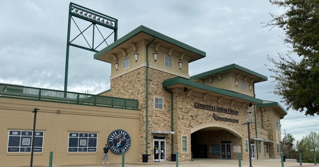 Ned Donovan stands in front of Constellation Field, home of the Sugar Land Space Cowboys, in Sugar Land TExas