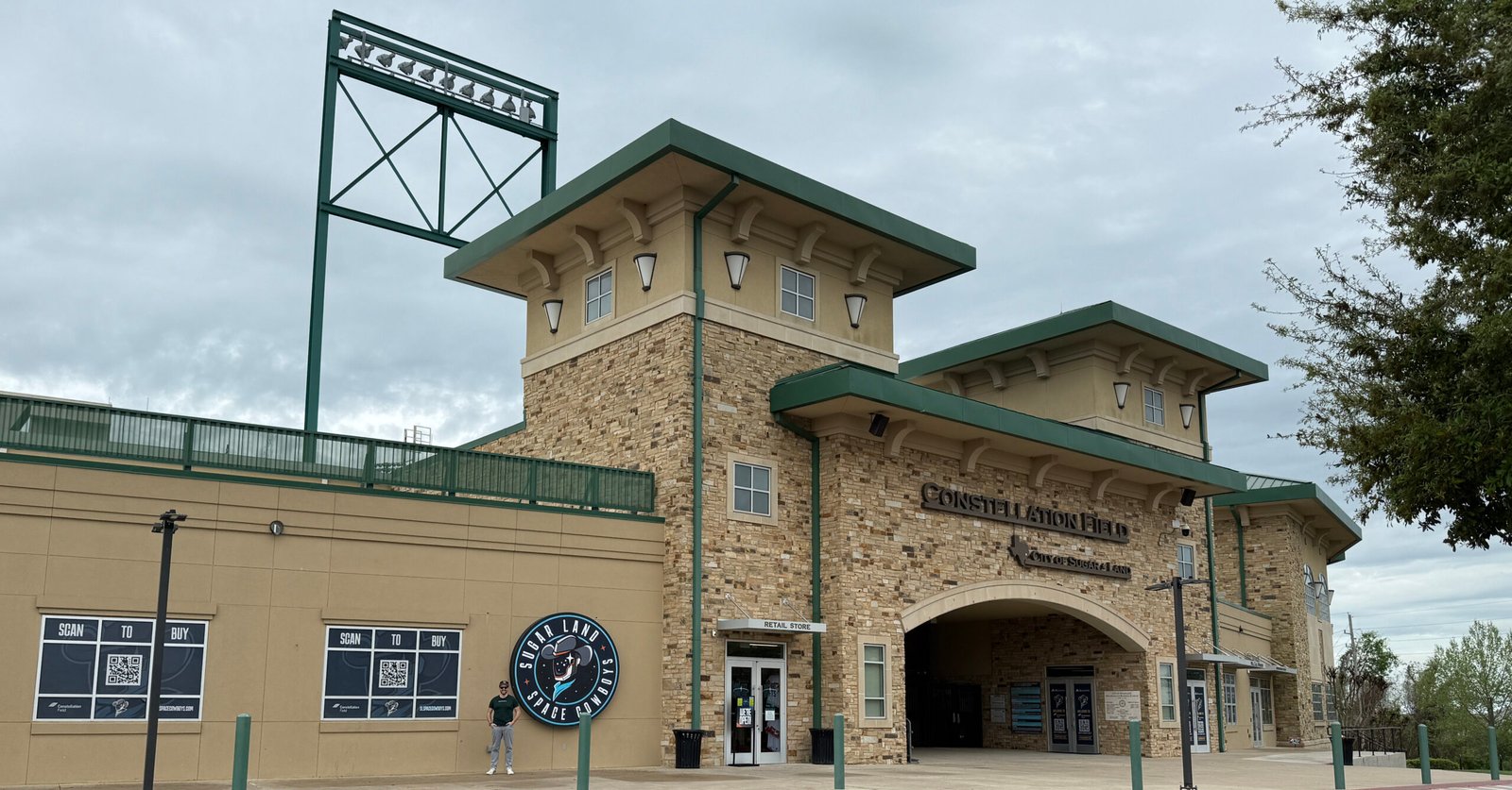 Ned Donovan stands in front of Constellation Field, home of the Sugar Land Space Cowboys, in Sugar Land TExas